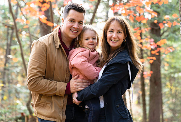istock family having fun in the autumn forest 2247648023