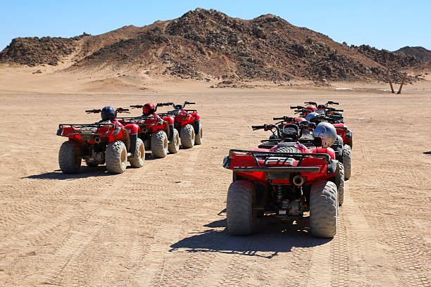 istock Red Quad Bikes Lined Up For Desert Safari Adventure, Egypt 2247648486