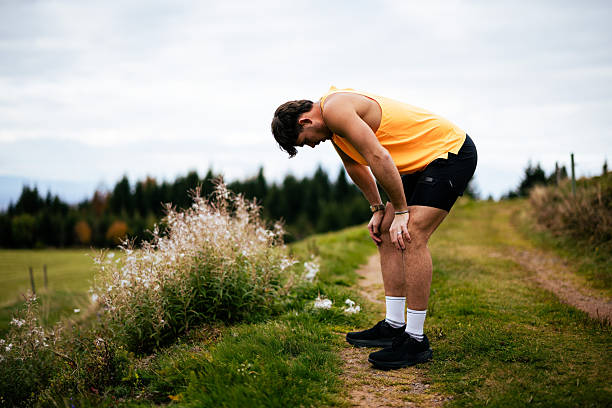 istock Trail runner pauses on trail on autumn day 2247648783