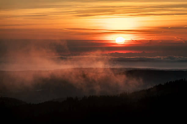 Sunrise over mountains and forest in autumn, mist rises from below, Black Forest, Baden-Württemberg