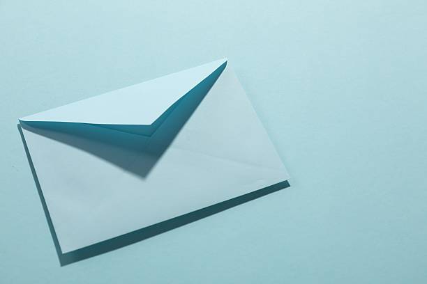 istock Paper envelope on light blue background, above view. Mockup for design 2247649041