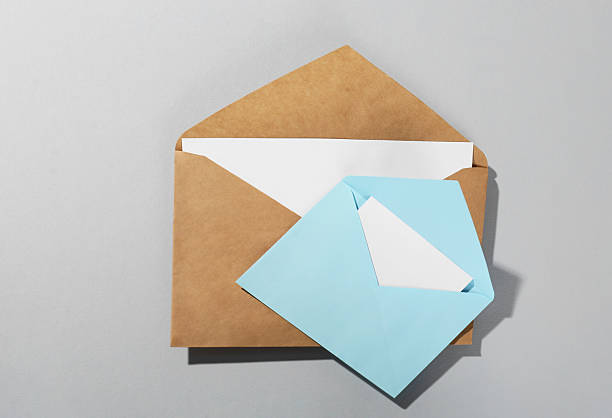 istock Paper envelopes with letters on grey background, above view. Mockup for design 2247649086