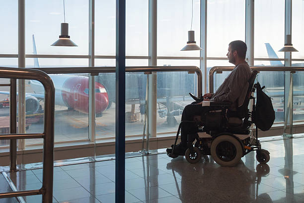 istock Wheelchair user at airport terminal 2247655744