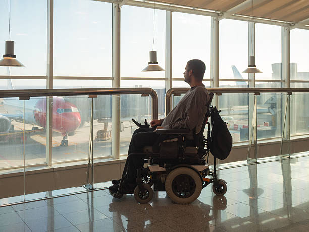 istock Person with disability navigating airport terminal 2247655750