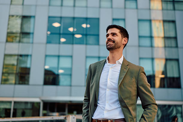 istock Confident young businessman looking up with optimism outdoors 2247657416