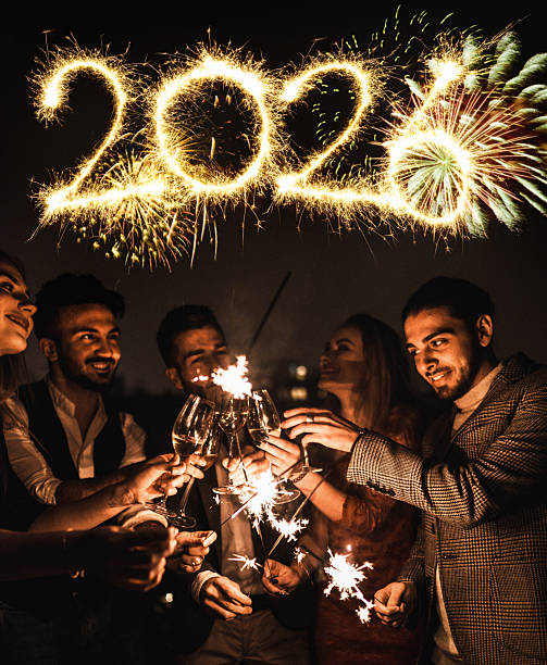 istock friends celebrate the new year in the rooftop 2247657982