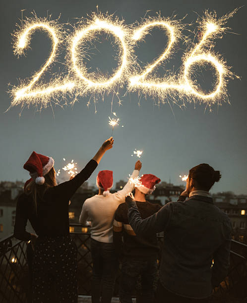 friends celebrate the new year in the rooftop