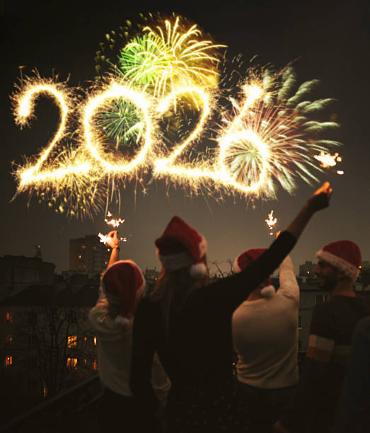 istock friends celebrate the new year in the rooftop 2247658030