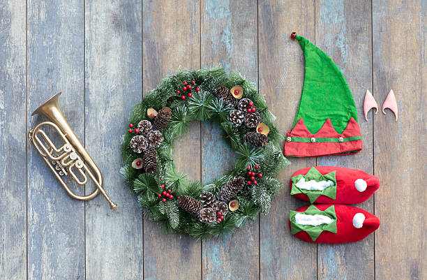 Christmas Wreath with red sound wave graphic equalizer bars and flying musical notes against black background.