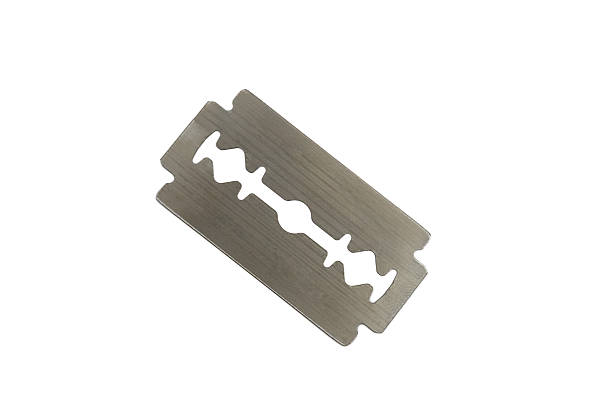 istock Steel Razor Blade Isolated on White Background 2247659326