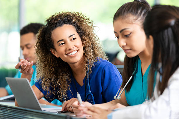 istock Diverse medical students collaborating and learning together in a classroom setting 2247660478