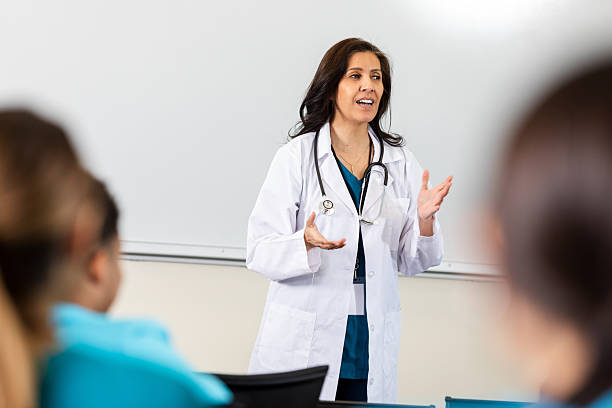istock Doctor enthusiastically explains medical concepts to students in a classroom setting. 2247660542