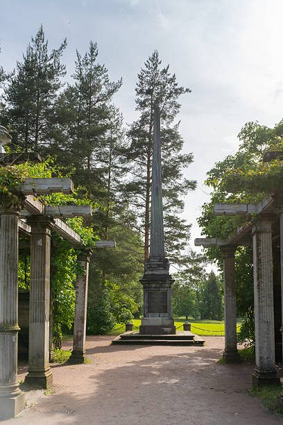 Pushkin, Russia, June 29, 2025. Kagul (Rumyantsev) Obelisk and pergola in Catherine Park. Tsarskoye Selo. In honor of victory of Russian arms under command of Count Rumyantsev over Turkish