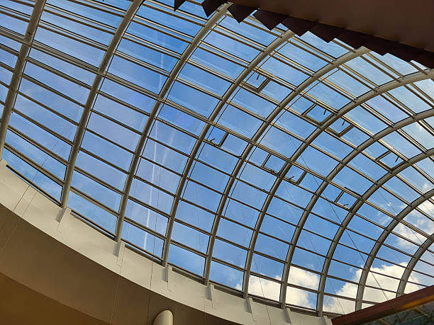istock Oval glass decorative ceiling against a blue sky, modern design 2247663513
