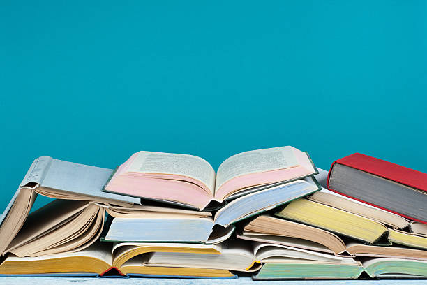 istock Open book, hardback colorful books on wooden table. Back to school. Copy space for text. Education business concept. 2247664006