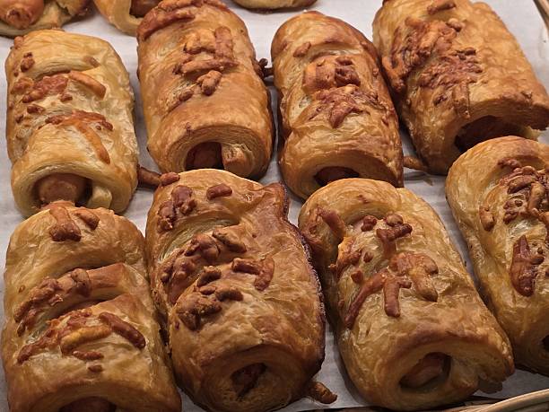 istock Golden Brown Savory Pastry Rolls Filled with Sausage and Cheese 2247664034