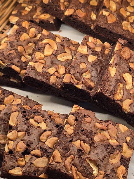istock Delicious Chocolate Brownies Topped with Crunchy Nuts on Plate 2247665617