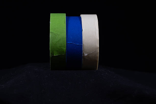 istock three multicoloured rolls of decorators masking tape isolated on 2247666391