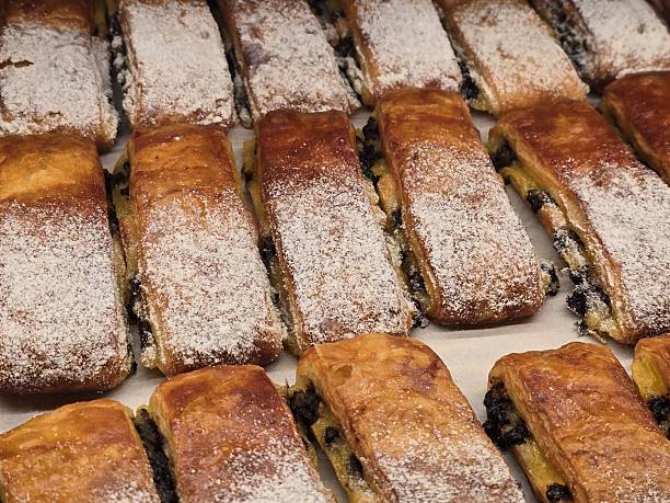 istock Freshly Baked Pastries with Powdered Sugar on a Wooden Surface 2247666486