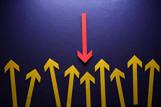 istock Red arrow facing the opposite direction yellow arrows 2247666947