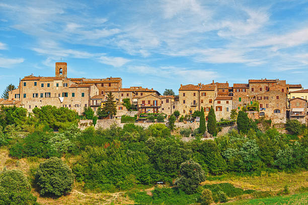 istock Casole d'Elsa panoramic view showing medieval stone buildings and a bell tower on a hilltop in the Siena province of Tuscany Italy 2247668434