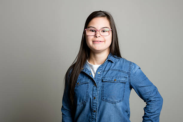 istock 18 years old child girl posing on grey background 2247669037