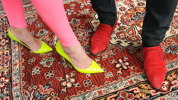 Bright shoes on a patterned carpet during a dance in the 90s.