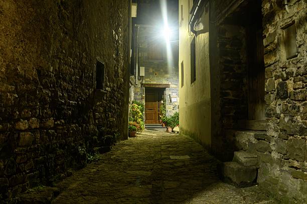 istock Charming stone alley at night with bright lights in Torla - Huesca 2247670650