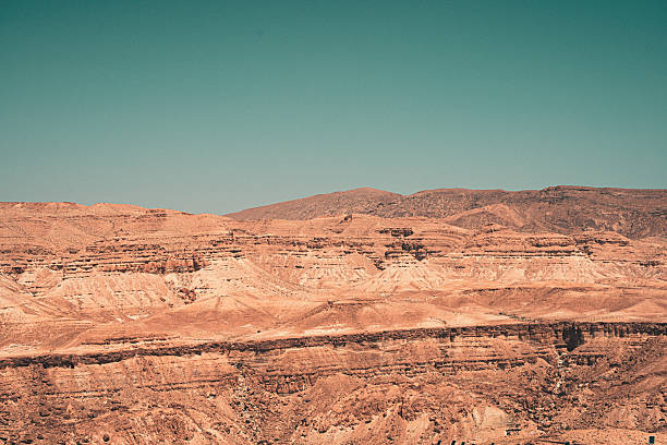istock Vast Panoramic View of Layered Sandstone Mountains Under a Clear Blue Sky. 2247671324