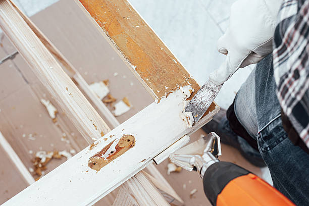 istock Carpenter at work, restoring an old wooden window. Carpentry. 2247675900