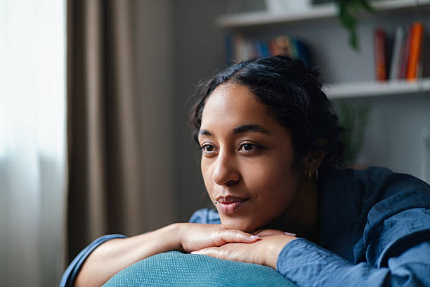 istock Thoughtful Woman Resting At Home: Calm Indoor Portrait With Soft Light 2247678886