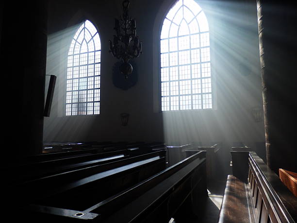 istock Church. Sunlight coming through the church window. 2247679155