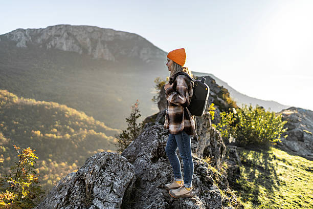 istock Woman hiking mountain enjoying the view 2247679367