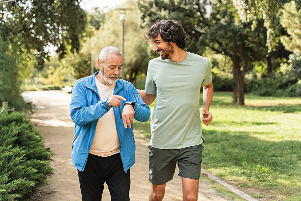 istock Senior man checking a smartwatch while walking and jogging in a park. healthy active lifestyle 2247681533