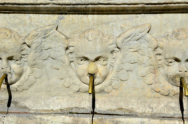 Close up of the marble cherubs  from a drinking fountain in the streets of Florence, Italy
