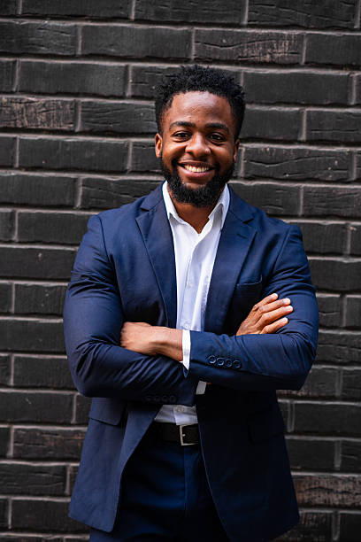 istock Black businessman with arms crossed looking at camera 2247682060