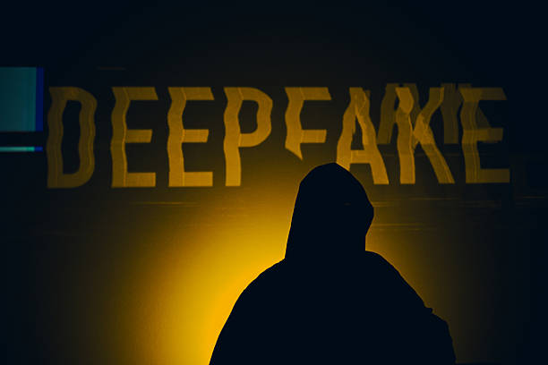 istock Hooded figure standing in front of deepfake text 2247682635