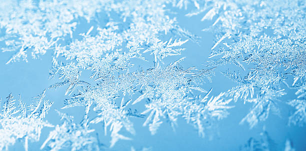 istock macro photo of an icy window on a light blue background 2247687843