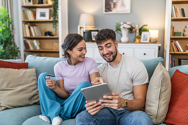 istock Young couple online shopping with credit card and tablet 2247688012
