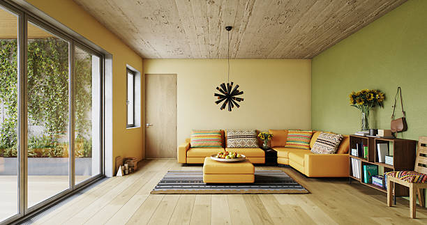 istock Modern Living Room with Orange Sofa and Balcony Greenery 2247688890