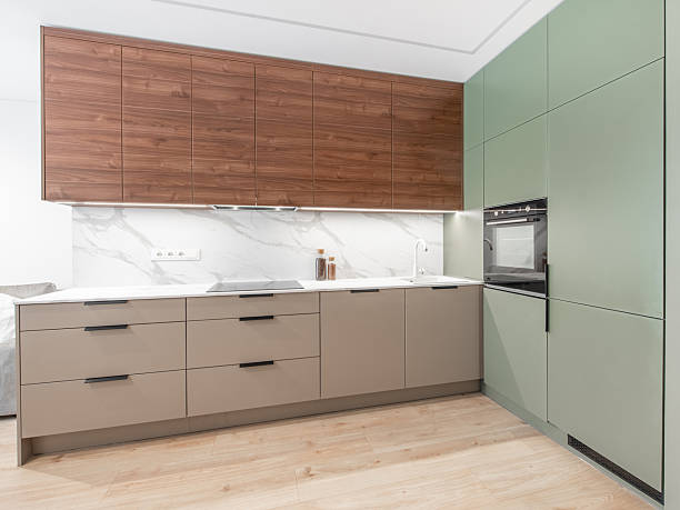 istock Modern Home Kitchen Interior with Minimalist Cabinets and Wooden Accents 2247690372