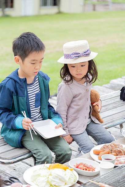 family enjoying barbecue