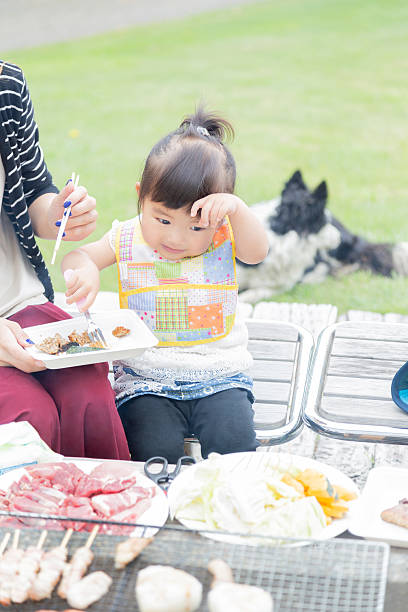 family enjoying barbecue