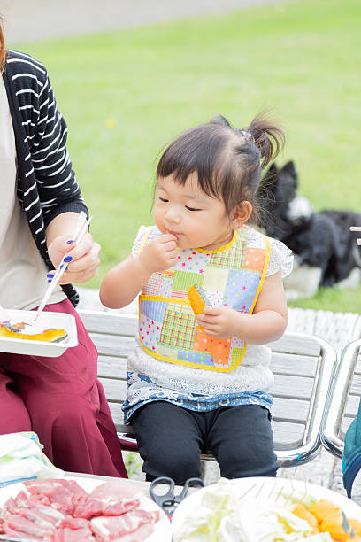 family enjoying barbecue