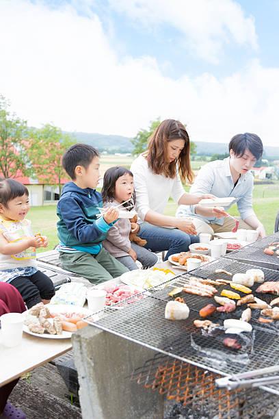 family enjoying barbecue