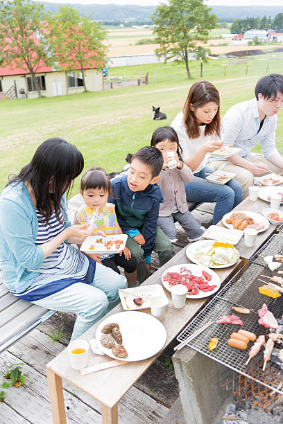 family enjoying barbecue