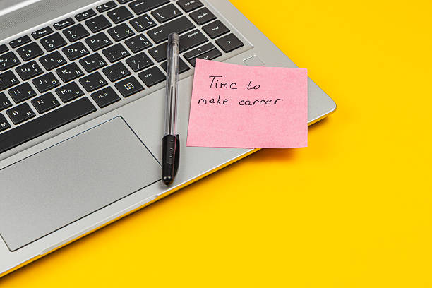 istock Motivational note on laptop encouraging career development 2247694738
