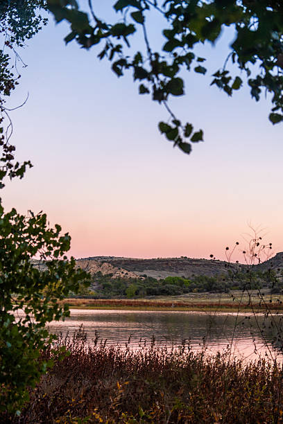istock tranquil sunrise reflecting on waters, peaceful early hours featuring silent lake and soft light 2247695633