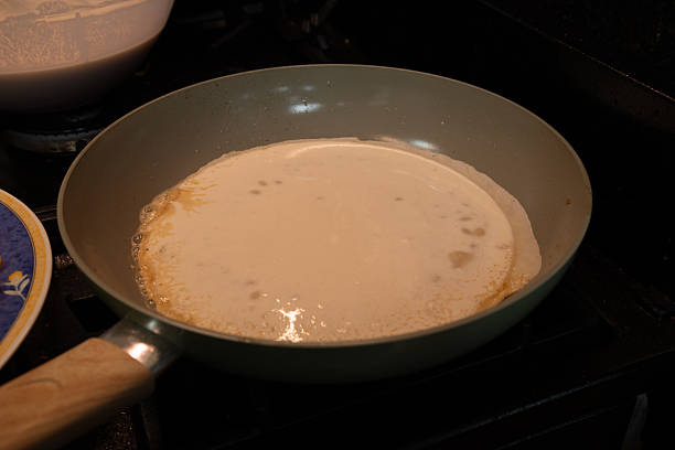 istock pancakes cooking on classic stove 2247697401