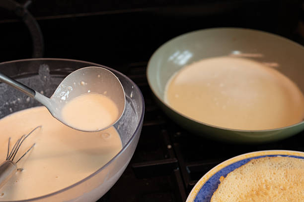 istock pancakes cooking on classic stove 2247697769